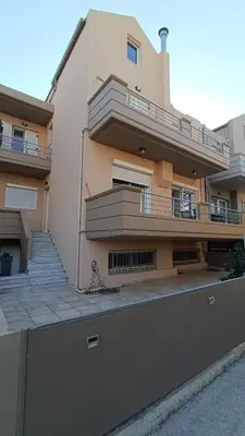 a building with a balcony and stairs on it at Ammos Family Villa in Daratso