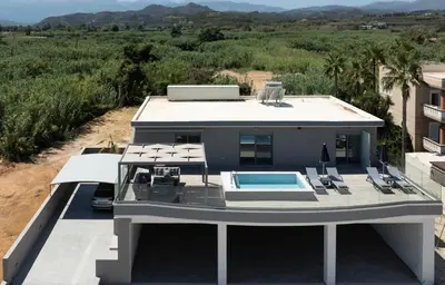 an aerial view of a house with a swimming pool at Casa Platanias Bridge in Plataniás