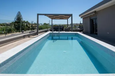 a swimming pool on the roof of a house at Casa Platanias Bridge in Plataniás