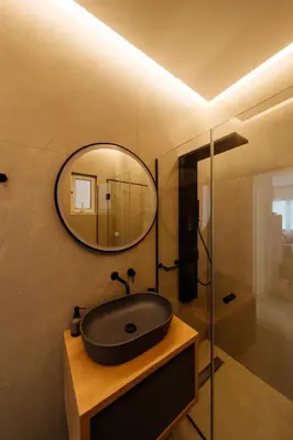 a bathroom with a black sink and a mirror at El Chacha Apartment in Galatás