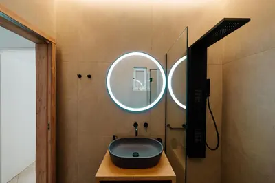 a bathroom with a sink and a mirror at El Chacha Apartment in Galatás