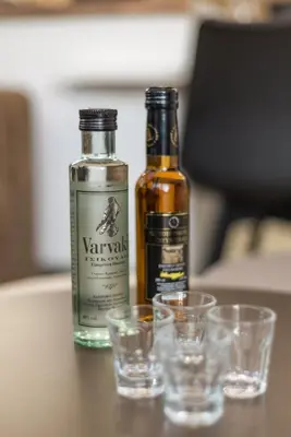 two bottles of whiskey and glasses on a table at Casa Manou - Kalyves beach in Kalyves