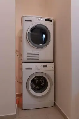 a washing machine and a dryer in a room at Maisonette with Exclusive Private Parking in Chania Town