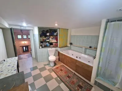 a bathroom with a tub and a toilet and a sink at KerAsh Villa Drapanias in Kissamos