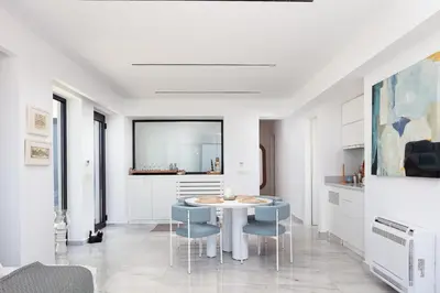 a dining room with a table and chairs at Casablanca Villa in Chania Town