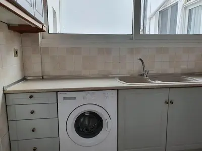 a kitchen with a washing machine and a sink at Charming Apartment In The Heart Of The City Chania in Chania Town