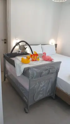 a bed with stuffed animals sitting on top of it at Casa Makda in Parigoría