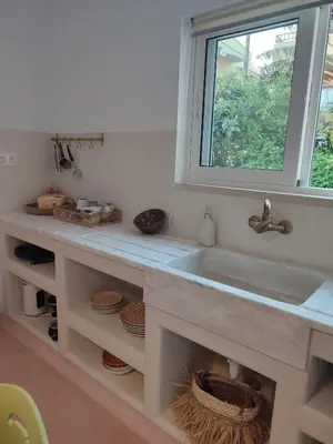 a bathroom with a sink and a window at Seamoon in Plataniás