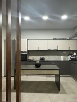 a kitchen with a table with a bowl on it at Catherine Apartment in Chania Town
