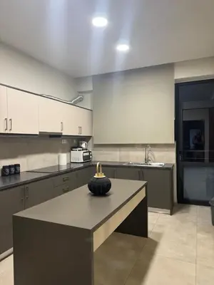 a kitchen with a table with a vase on it at Catherine Apartment in Chania Town