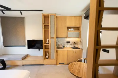 a small apartment with a kitchen and a living room at Aurora By Anasa in Palaiochóra