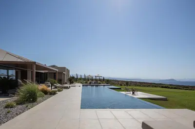 a swimming pool in the middle of a house at Kiyomi Villa in Chania Town