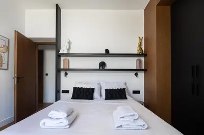 a bedroom with a bed with two towels on it at Kiyomi Villa in Chania Town