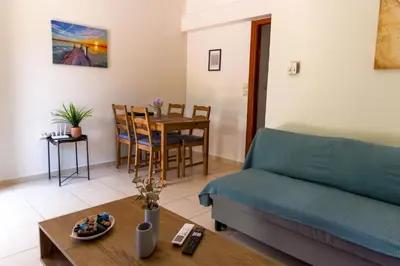 a living room with a couch and a table at Laurels Apartment in Chania Town