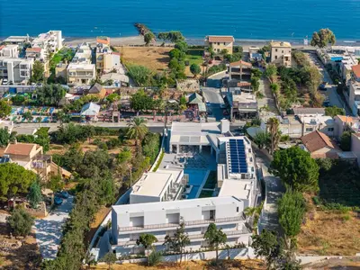 an aerial view of a resort and the ocean at Phos Hotel Adults Only in Plataniás