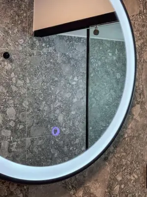 a mirror on the floor with a purple object in it at Casa in giardino in Chania Town