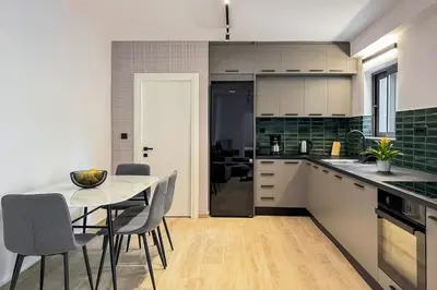 a kitchen and dining room with a table and chairs at Casa in giardino in Chania Town