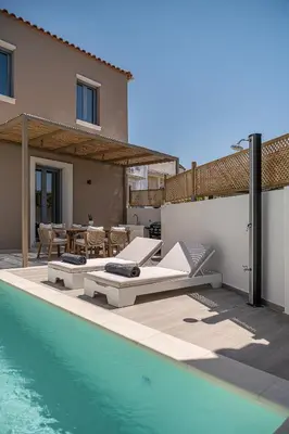 a villa with a swimming pool and a house at Villa Seyian in Chania Town