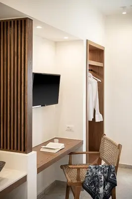 a room with a desk and a tv and a chair at Villa Seyian in Chania Town