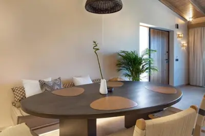 a living room with a table and a couch at Yemaya Sea View Villa in Chania Town