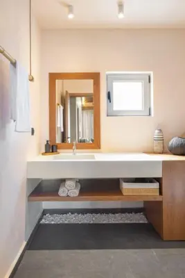 a bathroom with a sink and a mirror at Yemaya Sea View Villa in Chania Town