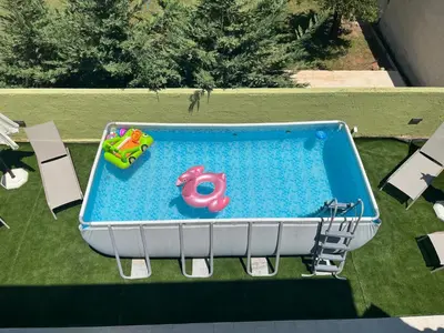 an overhead view of a swimming pool with a toy at GREENHOUSE maleme in Ayiá