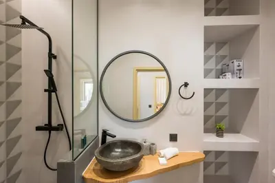 a bathroom with a sink and a mirror at Luxury villas Argalios in Drapaniás