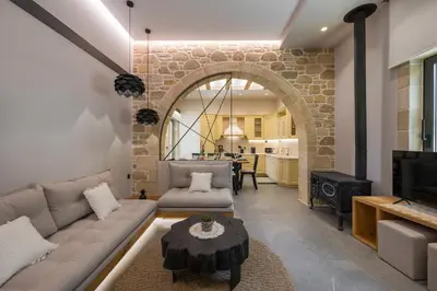 a living room with a couch and a table at Luxury villas Argalios in Drapaniás