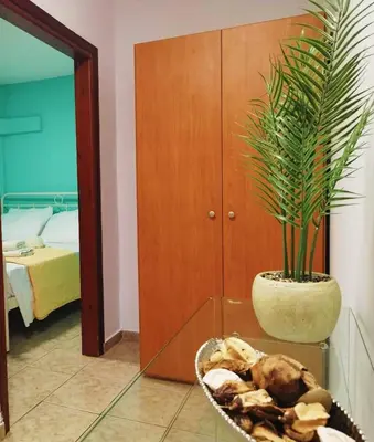 a room with a potted plant and a bowl of mushrooms at SleepiLi in Vrísai