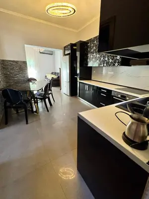 a kitchen and dining room with a table and chairs at Lia cozy apartment in Chania Town