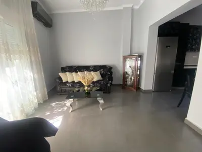 a living room with a couch and a table at Lia cozy apartment in Chania Town