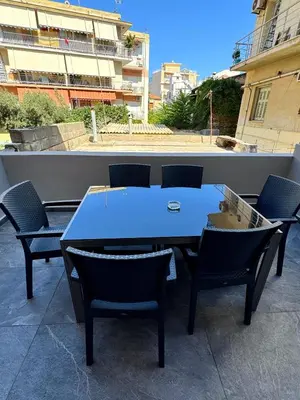 a blue table and chairs sitting on a patio at Lia cozy apartment in Chania Town