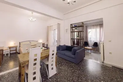 a living room with a couch and a table at Koumbes home in Chania Town