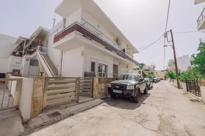 a car parked in front of a house at Koumbes home in Chania Town