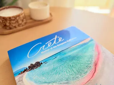 a book of the ocean on a table at Yia Banaki 1 Min Walk To Beach old Town 7min Walk in Chania Town