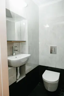 a bathroom with a white sink and a toilet at Be Crete - Villa Erofili in Chania Town