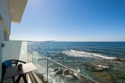 a view of the ocean from a balcony at Elia Sea Suites in Chania Town