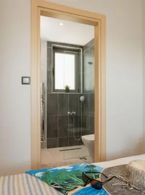 a bathroom with a shower and a toilet at Panoramic view villa - Selita in Tavronitis