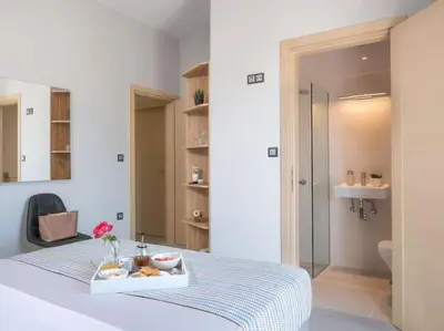 a bedroom with a bed with a tray of food on it at Panoramic view villa - Selita in Tavronitis