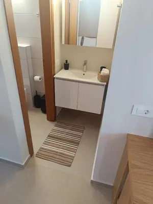 a bathroom with a sink and a mirror at Talos in Sougia