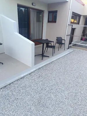a patio with a table and chairs on a building at Talos in Sougia