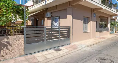 a building with a gate on the side of a street at GOZA Cozy house in Chania Town