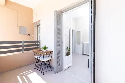 a small dining room with a table and a window at GOZA Cozy house in Chania Town
