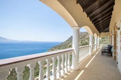 a balcony with a view of the ocean at Villa Sun Rock - Ravdoucha in Kolymvari