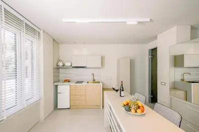 a kitchen with a bowl of fruit on a counter at Nidra Studio with private pool in Chania Town