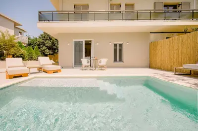 a swimming pool in the backyard of a house at Nidra Studio with private pool in Chania Town