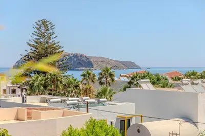 a view of the beach from the roof of a building at Platanias Memories Apartment in Plataniás