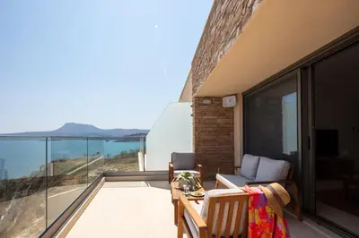 a balcony with a view of the ocean at Kalyves Coastal Retreat in Chania Town