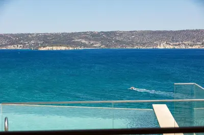 a boat in the middle of the water at Kalyves Coastal Retreat in Chania Town
