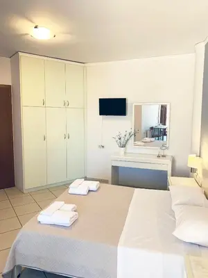 a bedroom with a large bed with towels on it at Platanias Memories Studio 5 in Plataniás